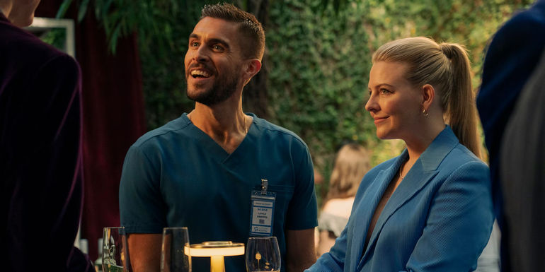 Lance (Josh Segarra) and Brooke (Helene Yorke) wear blue and smile in The Other Two.