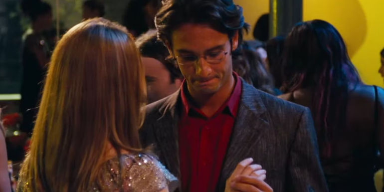 Karl holding Sarah's hand while dancing in Love Actually