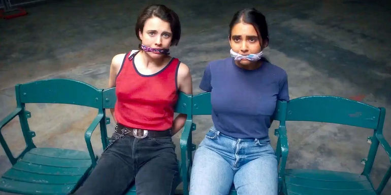 Jamie and Marian tied up in chairs in Drive-Away Dolls