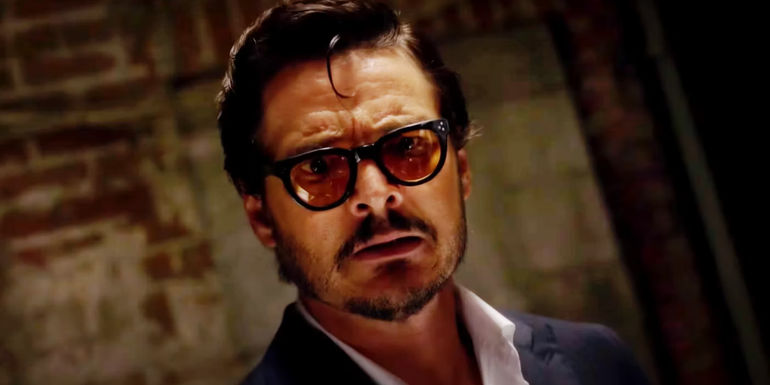 Pedro Pascal looking worried in Drive-Away Dolls