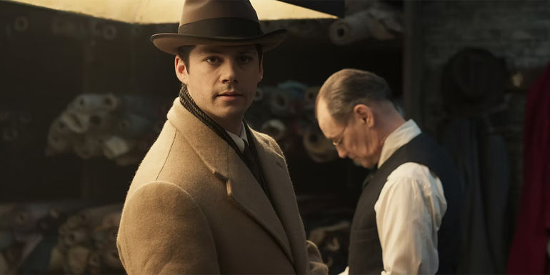 Dylan O’Brien as Richie looking angry in The Outfit