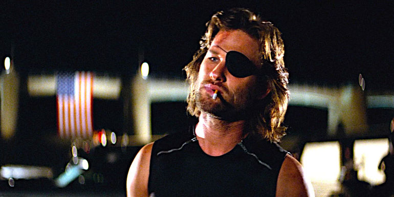 Kurt Russell smoking a cigarette and showing attitude as Snake Plissken in Escape From New York