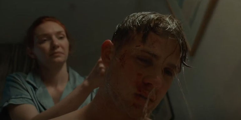 Sylvie bathing a bruised up Dexter in One Day