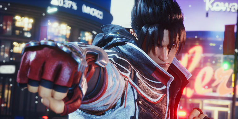 A screenshot of Tekken 8's Jin taken from his gameplay trailer, depicting Jin holding his gloved fist to the camera.