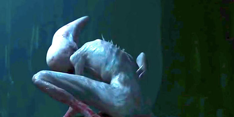 The Neomorph huddled over a body in Alien: Covenant
