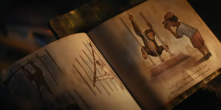 A book depicting a captured ape and a human in the Kingdom of the Planet of the Apes trailer