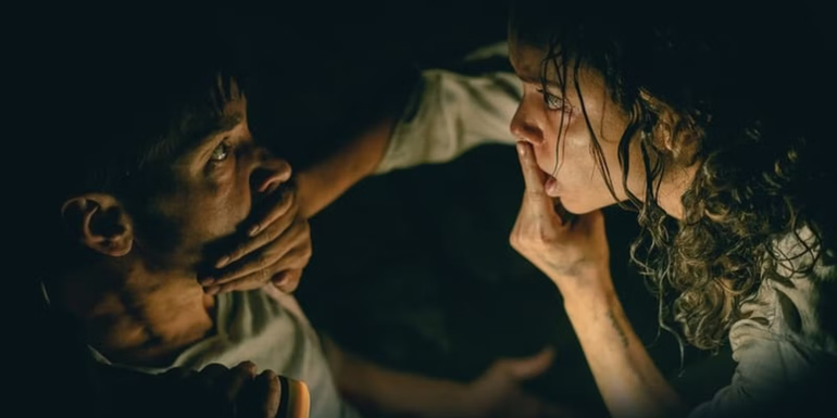Justin Long's AJ and Georgina Campbell's Tess in a dark basement in Barbarian