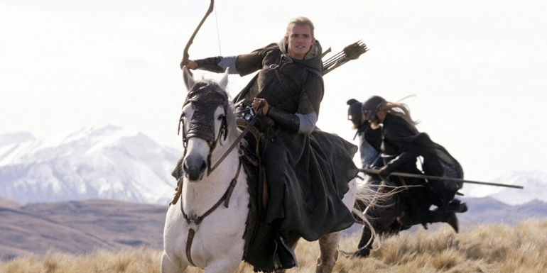 Legolas riding Arod and holding a bow