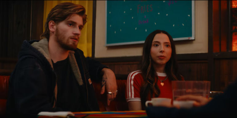 Danny Griffin and Esther Povitsky sitting next to each other in a diner booth in Drugstore June