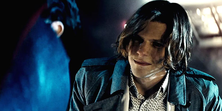 Jesse Eisenberg as Lex Luthor smiling and looking sideways in Batman v Superman Dawn of Justice