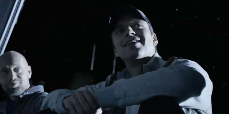 Beck (Sebastian Stan) smiling and looking over his shoulder in The Martian.