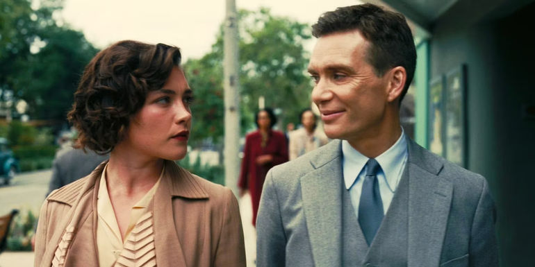 Florence Pugh and Cillian Murphy looking at each other in Oppenheimer. - Nolan Wasn't Claiming He Believes The Conspiracy - What The Black Glove In Jean Tatlock's Death Scene Really Represents