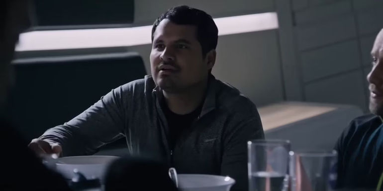 Hernandez (Michael Pena) looking up from his dinner on a spaceship in The Martian.