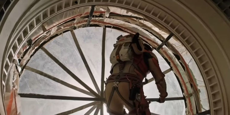 Mark Watney (Matt Damon) fixing the plastic Hab in The Martian.