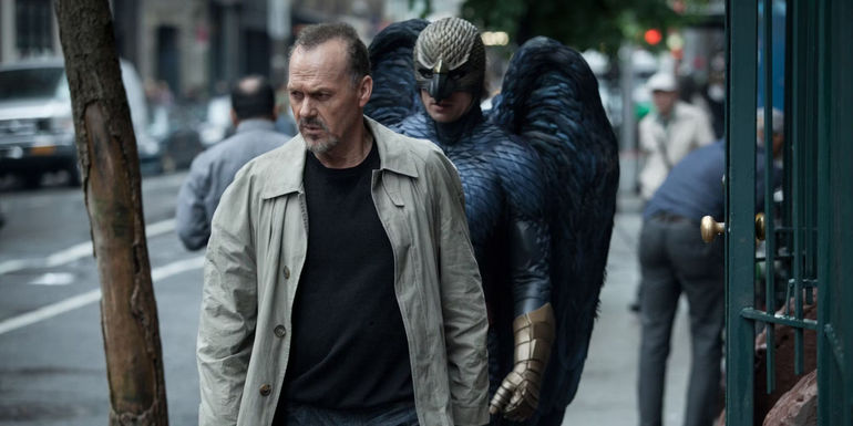 Michael Keaton's Riggan with Birdman behind him - Box Office: $102,926,247 - Birdman (2014)