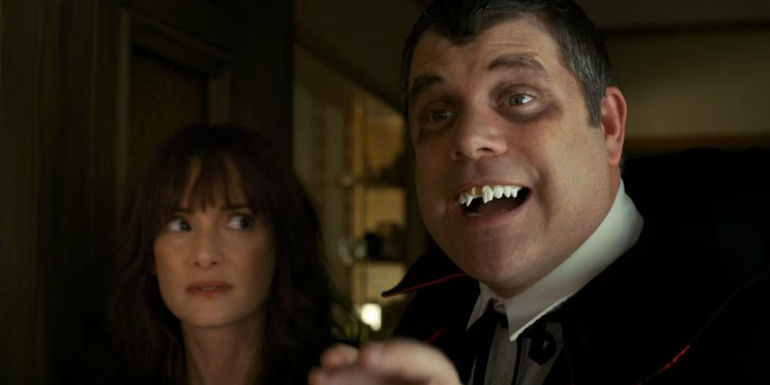 Bob (Sean Astin) wearing a Dracula costume next to Joyce (Winona Ryder)