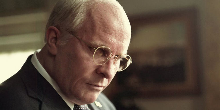 Christian Bale as Dick Cheney angrily staring ahead in Vice - Directed by Adam McKay