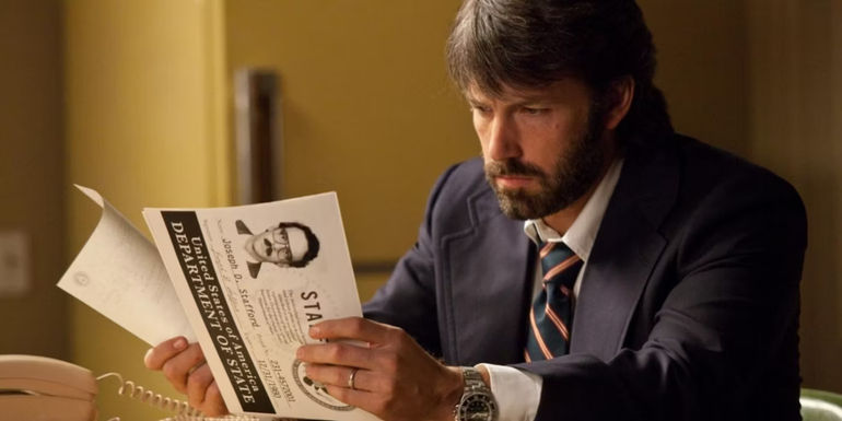 Ben Affleck looking at papers in Argo - Directed by Ben Affleck