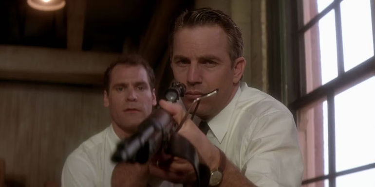 Kevin Costner holds a Carcano rifle in the film JFK - Directed by Oliver Stone
