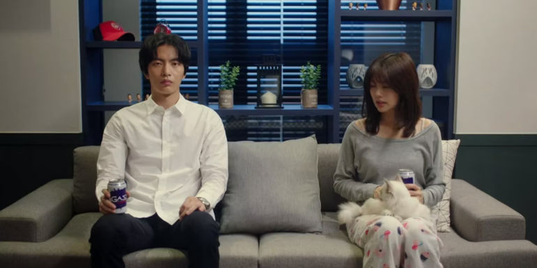 Nam Se-hee​​​​​​​ and Yoon Ji-ho on a couch in Because This is My First Life