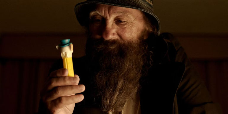 Steve Glew holsing up a PEZ dispenser in The PEZ Outlaw. - Glew Thinks His Story Is Worth Some Money - Glew Is Now In Debt Though He Has A Plan To Make It Back