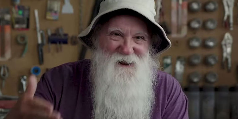 Steve Glew laughing and smiling in The Pez Outlaw. - Glew Found A Way To Get Rich Off Bringing PEZ To The US - A European PEZ Executive Helped Glew Make $4.5 Million In 11 Years