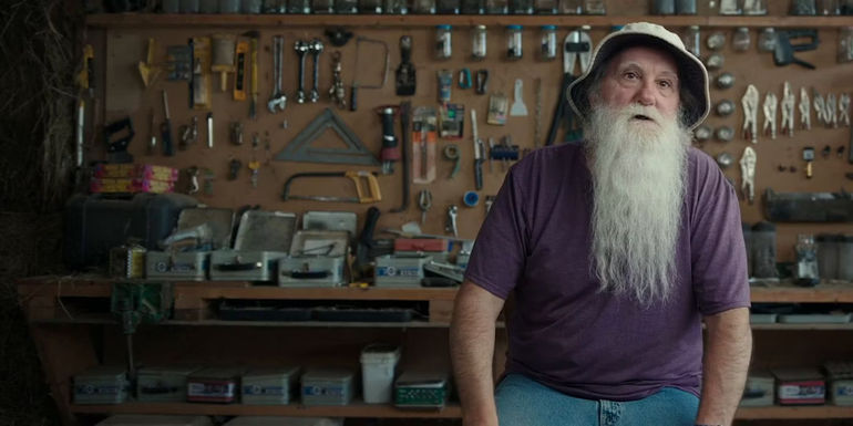 Steve Glew speaking in front of his tool wall in The Pez Outlaw. - The PEZ Outlaw Got His Start Out Of Necessity - Steve Glew Worked As A Machinist In Michigan And Sold Cereal Toys For Extra Money