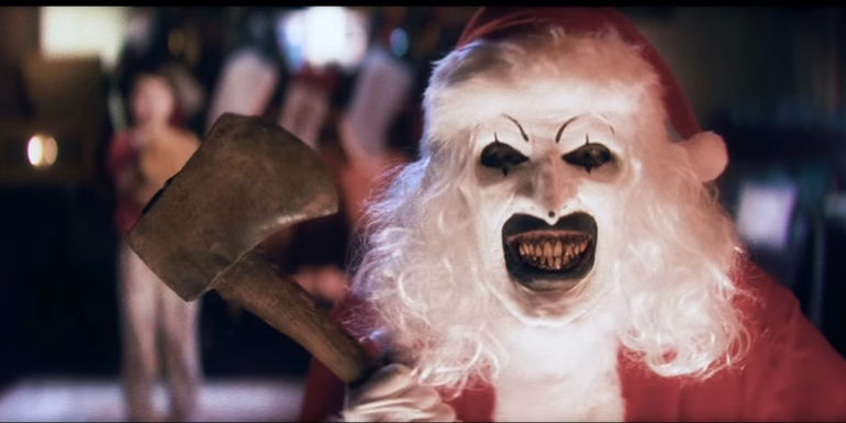 David Howard Thornton's Art the Clown dressed as Santa Claus with an Ax in Terrifier 3 trailer - Damien Leone Offers A Filming Update - Terrifier 3 Latest News