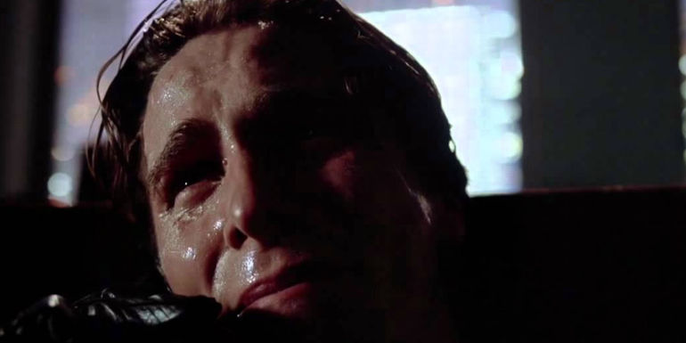 Patrick Bateman (Christian Bale) on the phone in American Psycho - Why An American Psycho Remake Is A Bad Idea