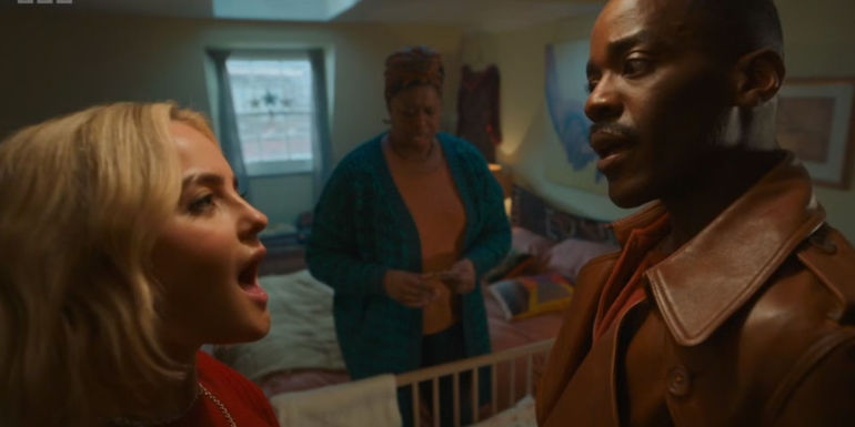 Millie Gibson and Ncuti Gatwa talking in Ruby's house with Michelle Greenidge in the background in the Doctor Who seasonal special