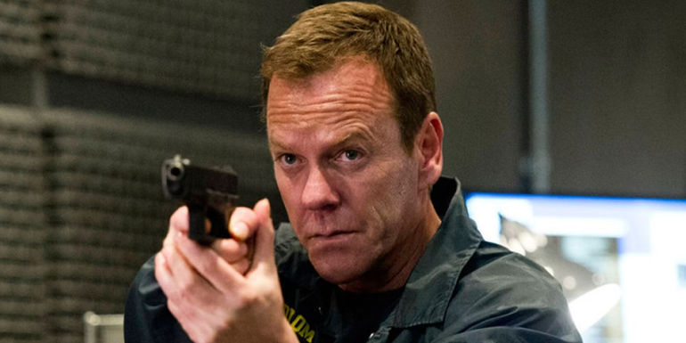 Jack Bauer holding a gun in 24 