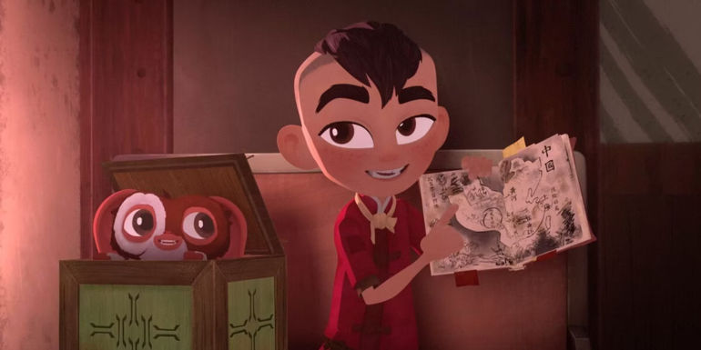 Sam points at a map while Gizmo looks on from Gremlins Secrets of the Mogwai