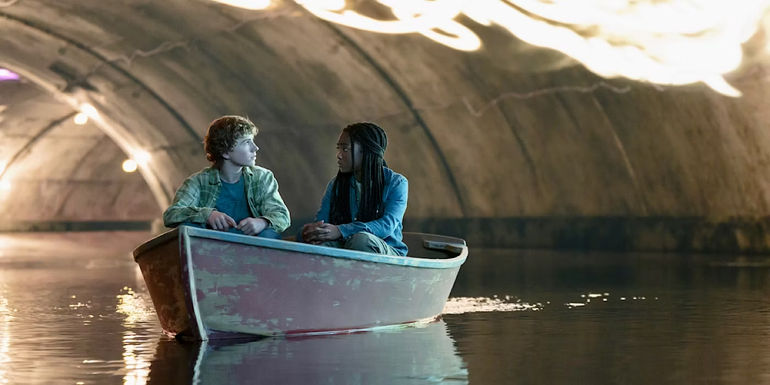 Walker Scobell and Leah Jeffries as Percy and Annabeth sitting in a boat in Percy Jackson and the Olympians.