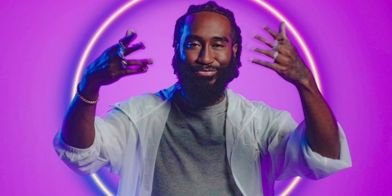 Chaz Lawery gestures to the camera in a promotional image for The Circle season 5.