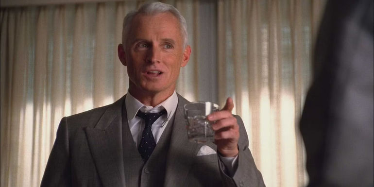 Roger having a drink in Mad Men