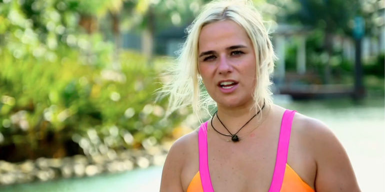 Emily from Married At first Sight season 17 wearing a orange and pink bikinki top for interview