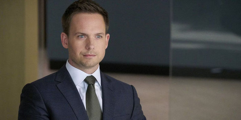 Mike Ross smirking in an office in Suits Season 7.