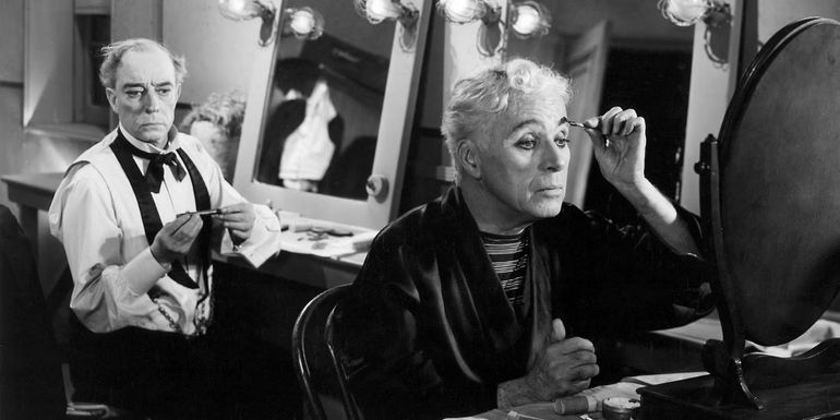 Charlie Chaplin and Buster Keaton apply makeup in Limelight