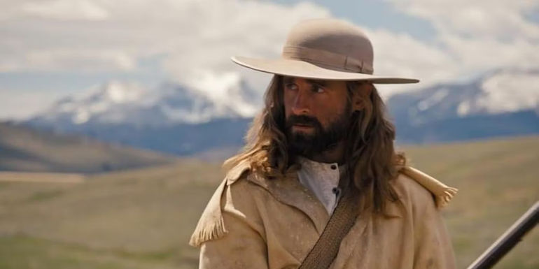 James Hal Hardy as Jedediah Smith holding a gun and looking back in Into the Wild Frontier.-1