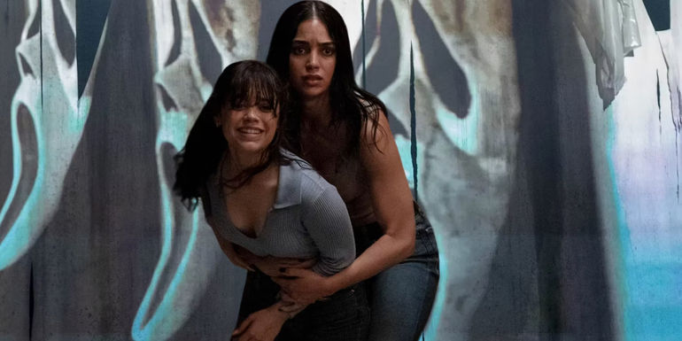 Melissa Barerra's Sam and Jenna Ortega's Tara look scared in front of Ghostface projection in Scream 6