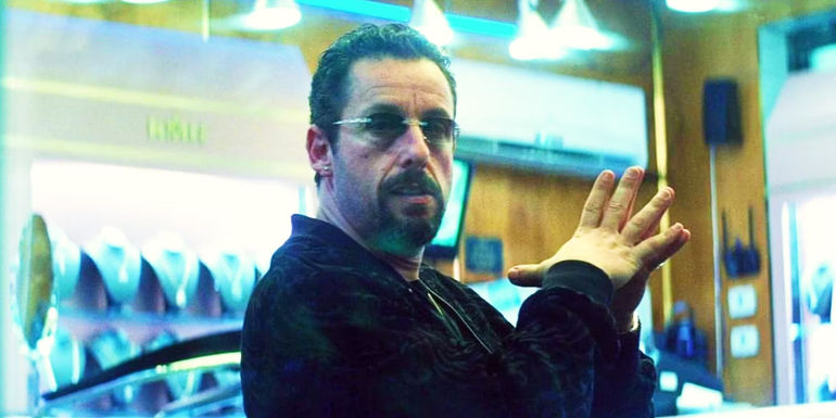 Adam Sandler pressing his palms together in Uncut Gems.