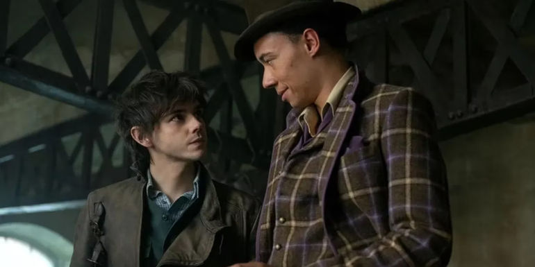 Jack Wolfe as Wylan and Kit Young as Jesper staring at one another in Shadow and Bone