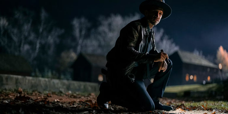 Bradley Stryker kneeling on the ground in Devil in Ohio.