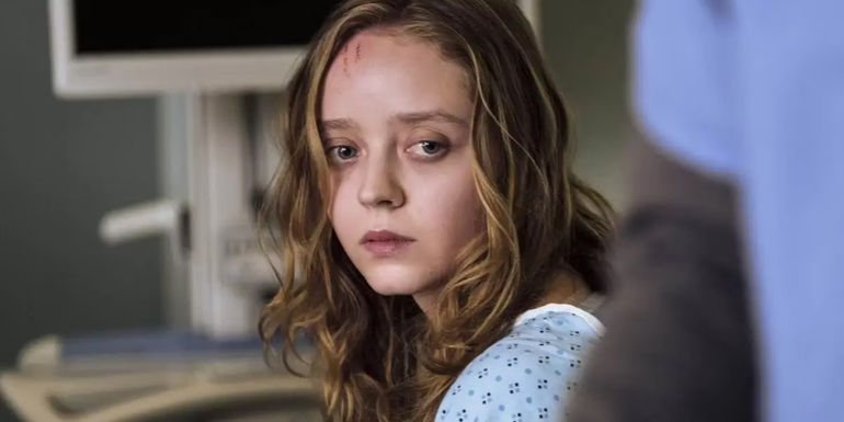 Madeleine Arthur as Mae looking confused in a hospital in The Devil in Ohio.