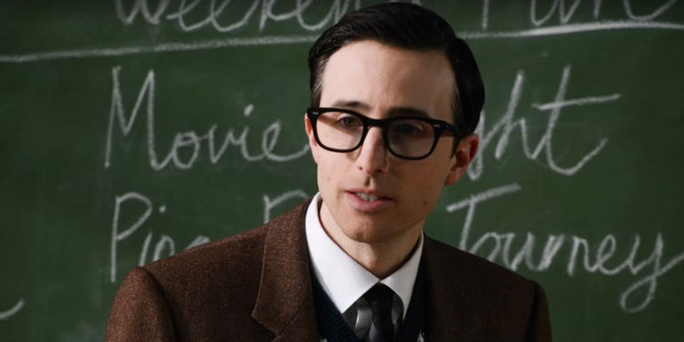 Mr. Martin in front of board in School Spirits