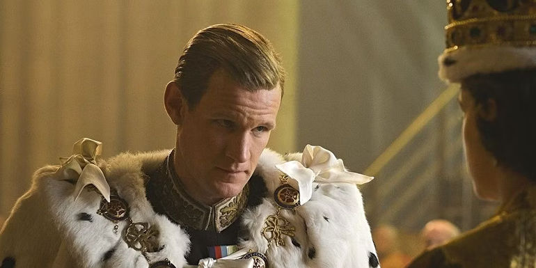 Prince Philip kneels in front of the Queen in The Crown