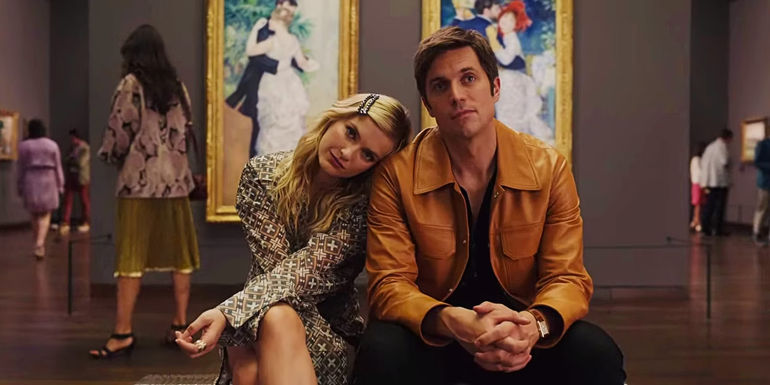 Camille Razat as Camille and Lucas Bravo as Gabriel Sitting Together in a Museum in Emily in Paris Season 3 Episode 9