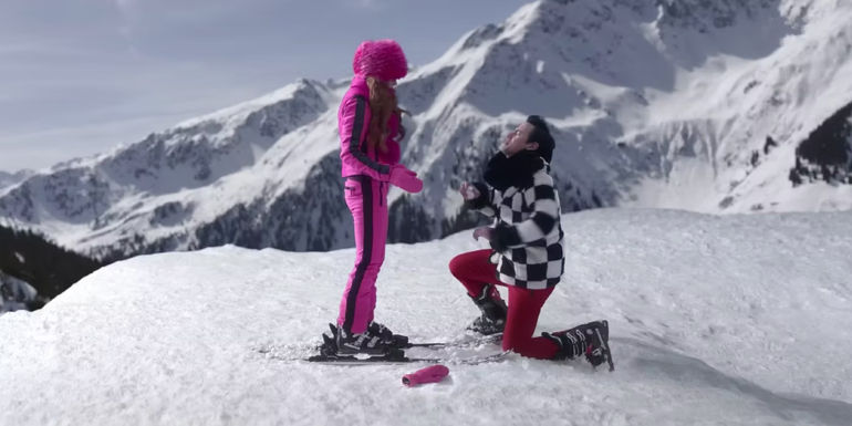 Lindsay Lohan as Sierra is proposed to be George Young as Tad in the snow in the Netflix movie Falling for Christmas