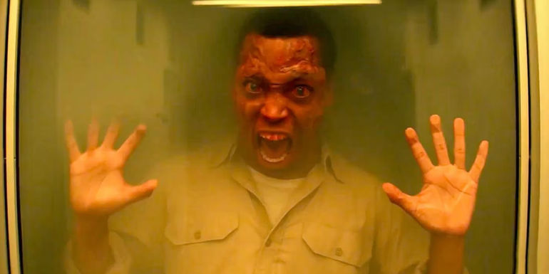 A Black person stuck in a box for a mustard gas experience in THEM