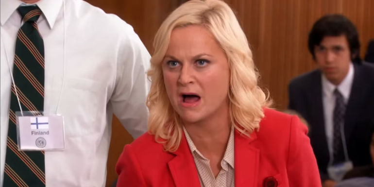 Leslie yells an aggressive insult at Ben at the model UN.
